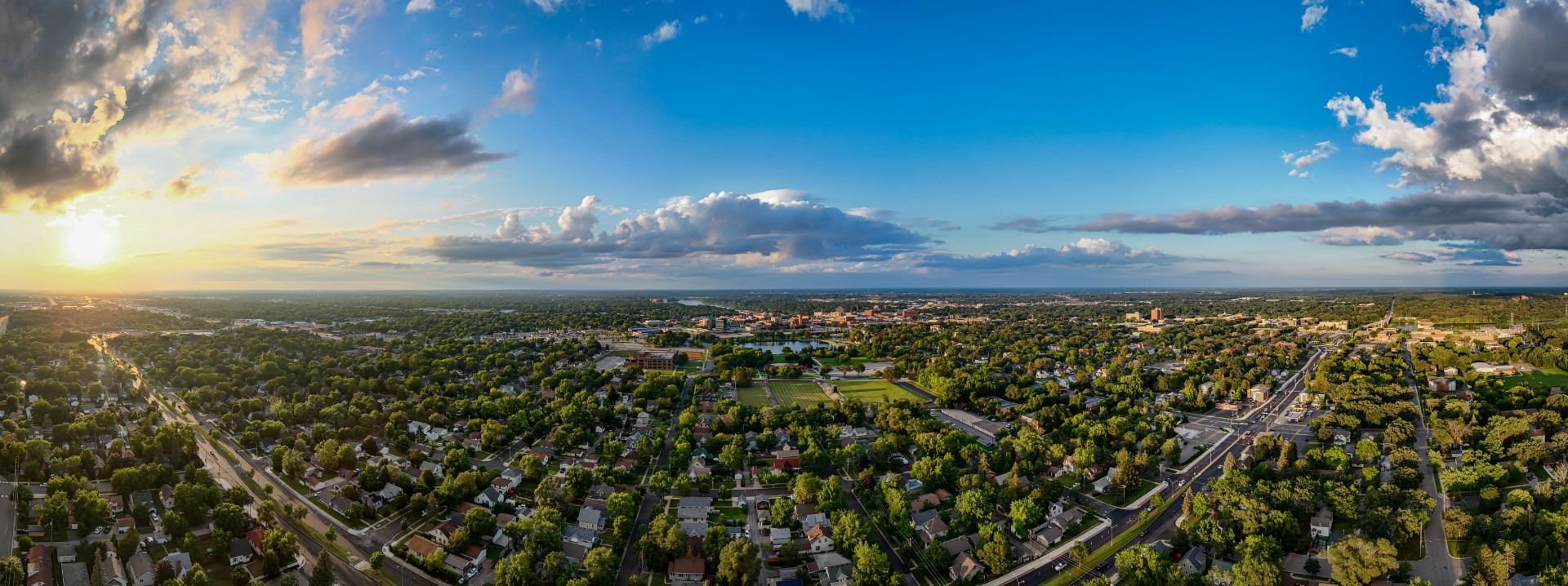 dreyton_nichols_panoramicofsaintcloud Large Panoramic view of Saint Cloud, MN, showcasing University Drive South, Lake George, City Hall, most of downtown, the Mississippi River, and a stunning sunset in the background.
