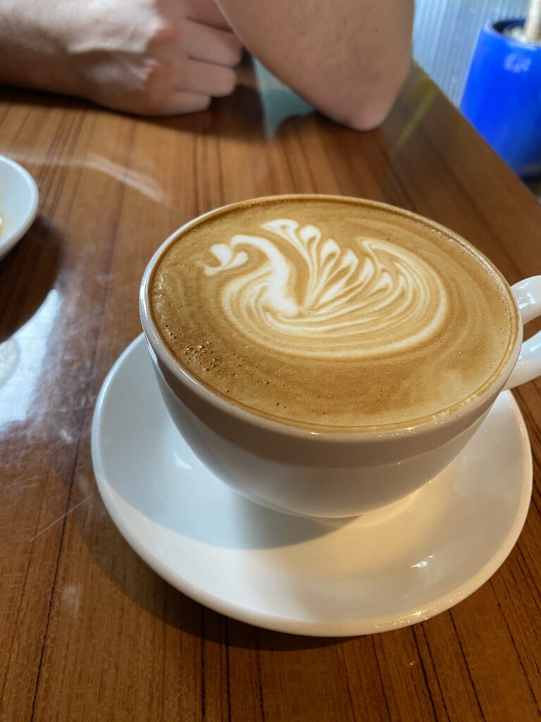 Swan design in cafe latte from District Coffee