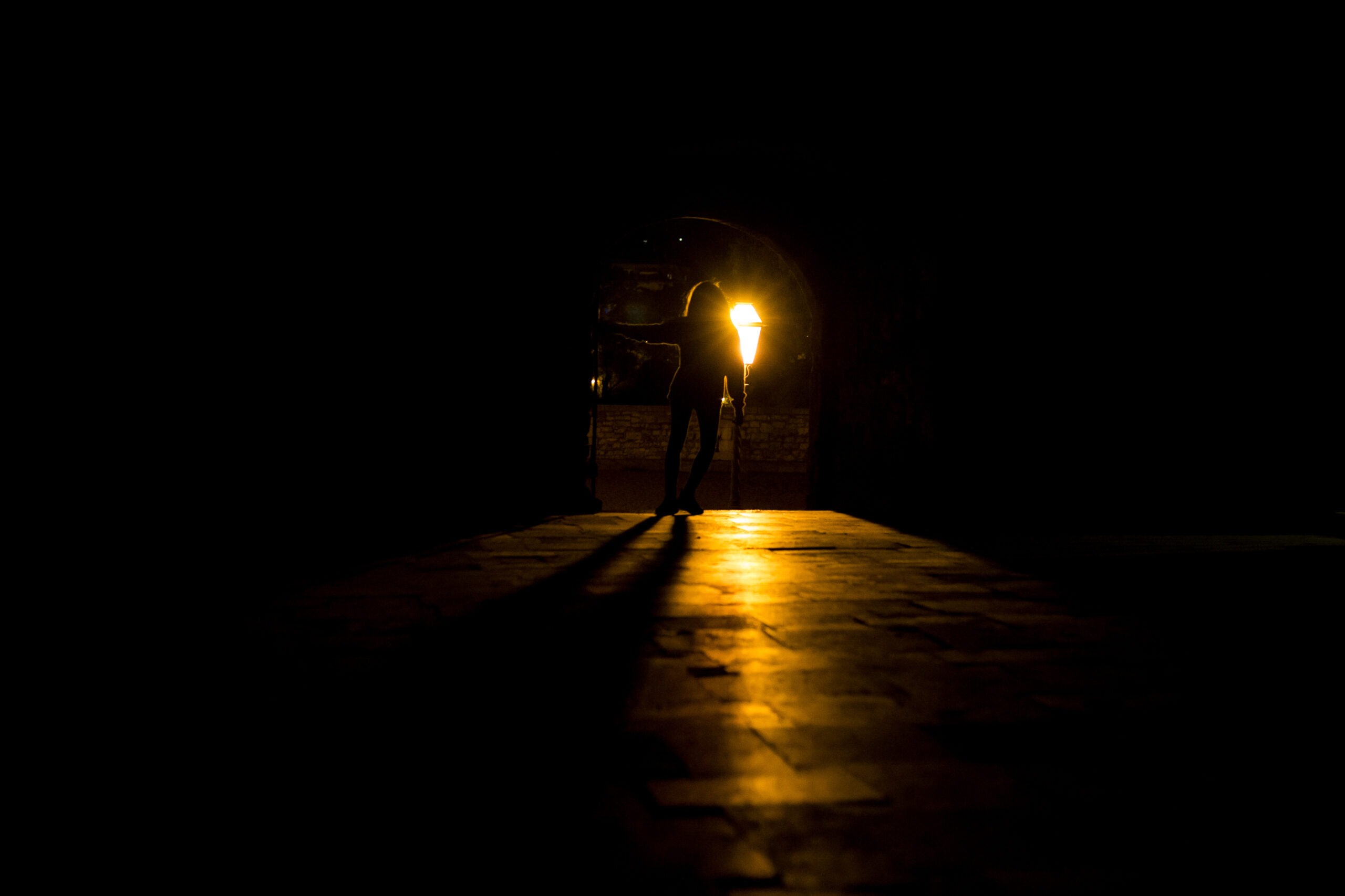 Silhouette of a girl who stands in front of a light source